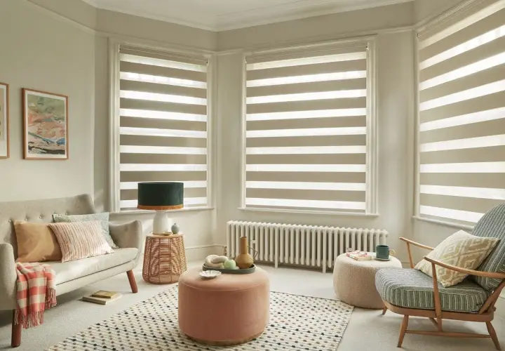 Modern living room with striped roller blinds, offering a stylish way to choose best window coverings.