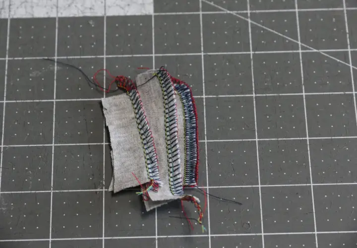 Serger troubleshooting: tangled threads and uneven stitches on fabric scraps.