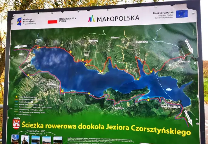 Mapa szlaku rowerowego wokół Jeziora Czorsztyńskiego z zaznaczonymi trasami i miejscowościami.