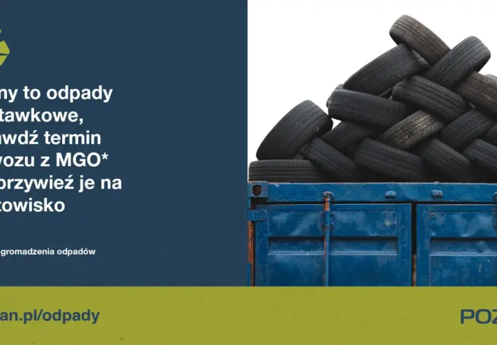 Stos zużytych opon w niebieskim kontenerze.