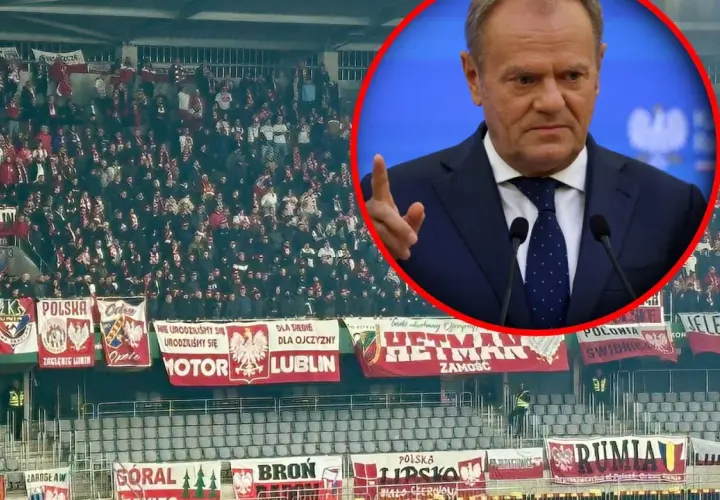 Tłum kibiców na stadionie z transparentami "Polska" i "Lublin", w tle Donald Tusk. Litwa – Polska.