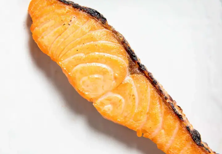 A perfectly cooked, flaky piece of salmon, ready for a delicious salted salmon recipe.