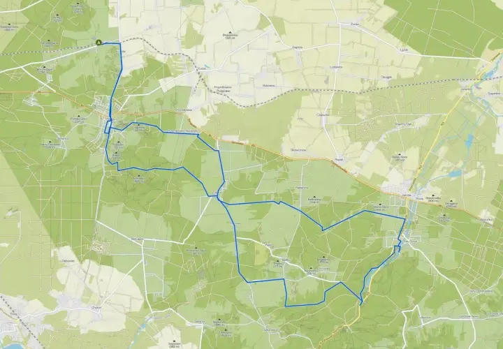 Mapa z zaznaczonymi trasami rowerowymi wokół Olsztyna. Trasa prowadzi przez lasy i tereny pagórkowate.
