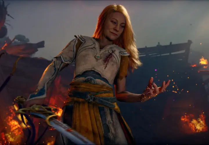 La guerriera bionda, con un'armatura ferita, evoca scintille in un paesaggio in fiamme. Un nuovo God of War è in arrivo.