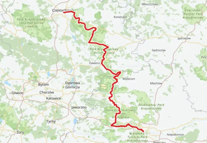 Mapa z zaznaczonym czerwonym szlakiem rowerowym, biegnącym przez Park Krajobrazowy Orlich Gniazd, od Częstochowy po okolice Krakowa.