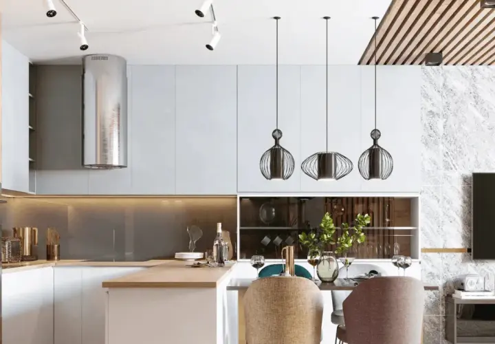 Cocina moderna con campana extractora plateada, lámparas colgantes de diseño y una mesa lista para cenar. La iluminación ambiental crea una atmósfera acogedora, con suficientes **lúmenes por m2** para cada actividad.