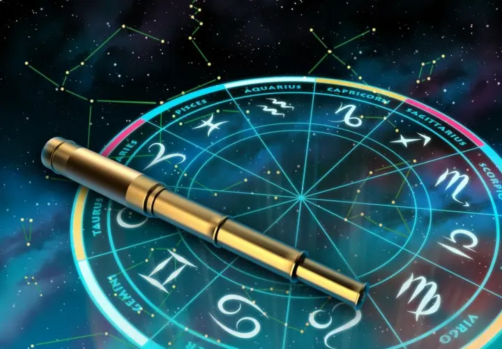 Złoty teleskop na tle koła zodiaku i konstelacji.