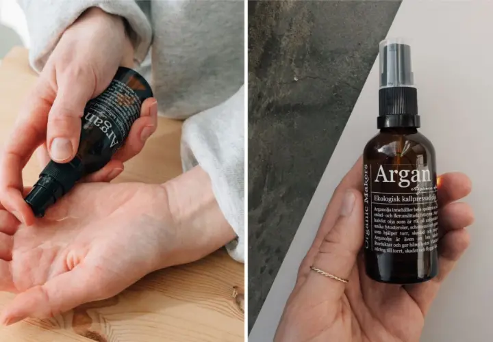 En hand applicerar arganolja för hudvård. Flaskan med ekologisk kallpressad arganolja syns också.