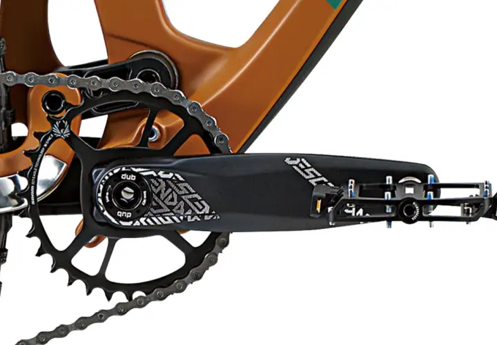 Close-up of a bike's crankset and chainring, showing the DUB bottom bracket and pedal.