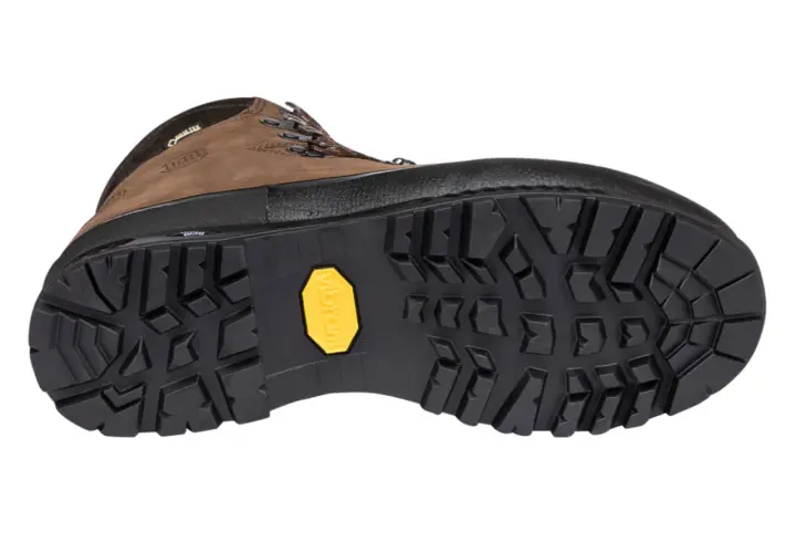 A brown hiking boot with a rugged, deep-lugged Vibram sole, showcasing various types of boot soles for optimal traction.