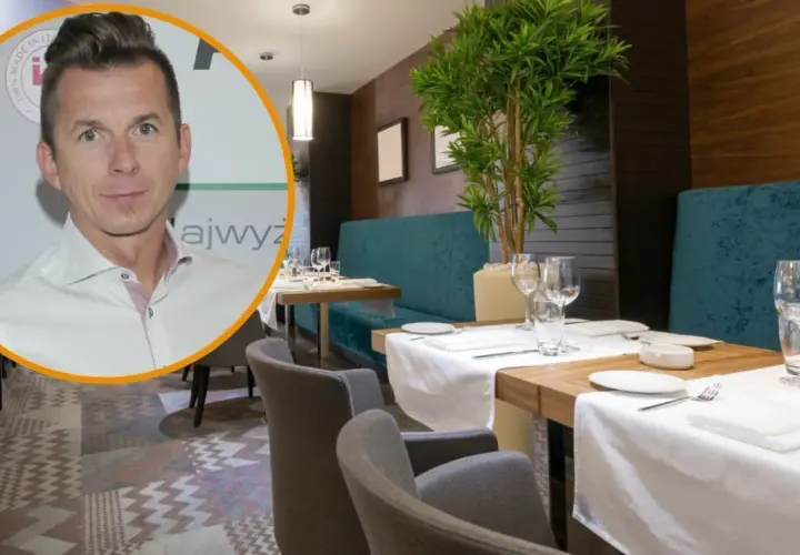 Karol Okrasa w eleganckiej restauracji, gotowy na degustację wykwintnych dań.