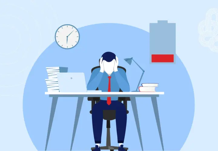 A stressed person at a desk with a low battery icon, symbolizing the need for a thriving mindset to overcome burnout.