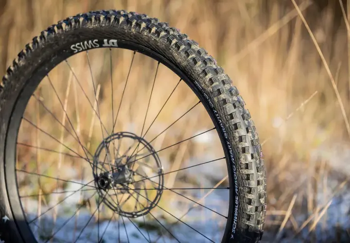 Close-up of a DT Swiss wheel with a Schwalbe Magic Mary tire, ready for a gravity-defying review.