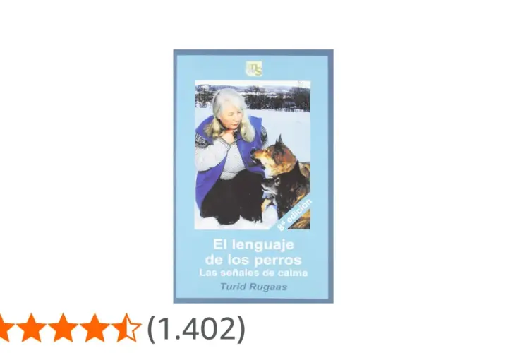 Libro "El lenguaje de los perros. Las señales de calma" de Turid Rugaas. Una mujer interactúa con dos perros en la nieve, aprendiendo sobre las señales de calma perros.