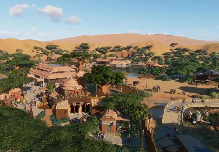Vue aérienne d'un zoo inspiré de l'Afrique, avec des éléphants, des girafes, des bâtiments aux toits de chaume et des dunes en arrière-plan. Un exemple de configuration Planet Zoo.