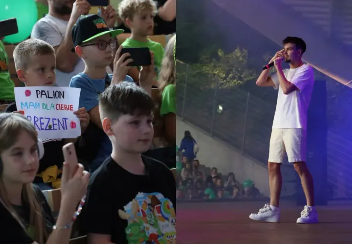 Dzieci na koncercie, jedno z nich trzyma transparent "PALION mam dla ciebie prezent". Na scenie artysta.
