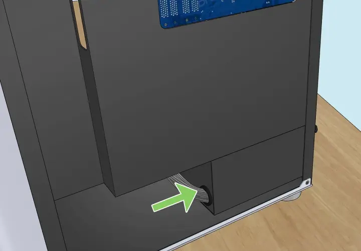 Flèche verte indiquant le passage des câbles pour le test alimentation pc.