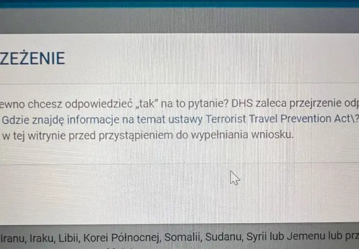 Okno dialogowe z ostrzeżeniem "OSTRZEŻENIE" dotyczące pytania o podróże do USA.