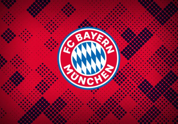 Herb FC Bayern Monachium na tle czerwono-granatowych kropek. Duma Bawarii.