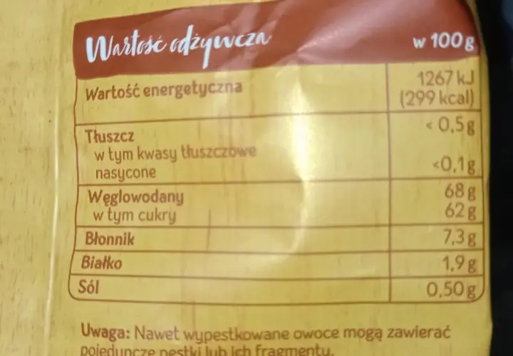 Tabela wartości odżywczych suszonych jabłek: 299 kcal w 100g, 68g węglowodanów, 62g cukrów.