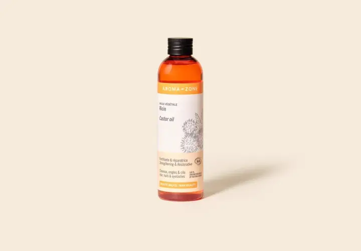 Bouteille d'huile de ricin Aroma-Zone, vantant ses bienfaits fortifiants et réparateurs pour cheveux, ongles et cils.