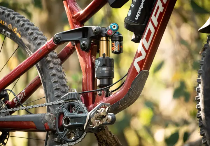 Close-up of a Norco Sight bike's rear suspension, featuring a Fox Float X2 shock. This detailed shot is perfect for a fox float x2 review.
