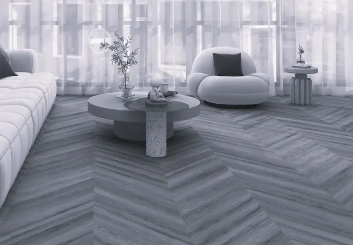 Nowoczesny salon z sofą i fotelem, a podłogę zdobi elegancka jodełka francuska.