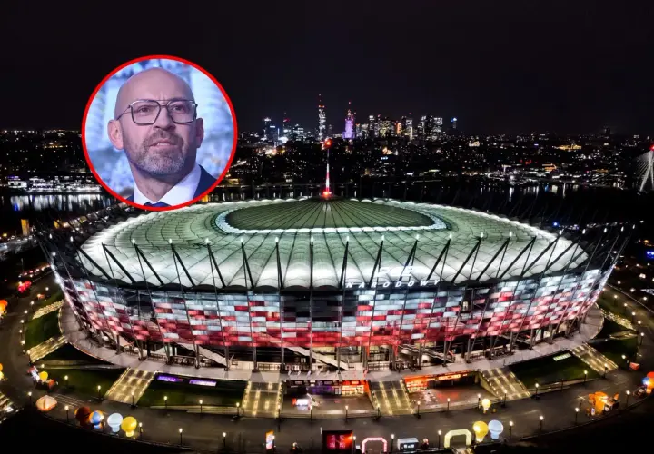 Wizerunek mężczyzny w okularach na tle nocnego Stadionu Narodowego. Dyskusja o tym, ile kosztował Stadion Narodowy, trwa.