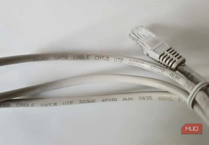 Two grey Cat.5 ethernet cables are shown, one with an RJ45 connector. The text on the cables indicates they are suitable for data transmission, with no mention of minimum ethernet cable length.
