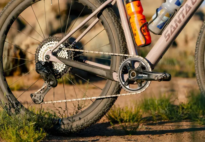 Close-up of a gravel bike's drivetrain, featuring Shimano GRX components. A detailed shimano grx review would highlight this robust gearing.