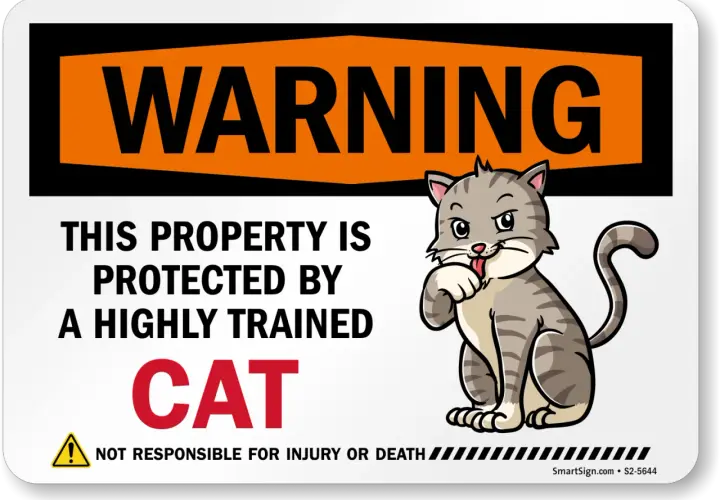 Warning sign: "This property is protected by a highly trained CAT." A cartoon cat is shown with its paw near its mouth, as if in a moment of cat head pressing contemplation.