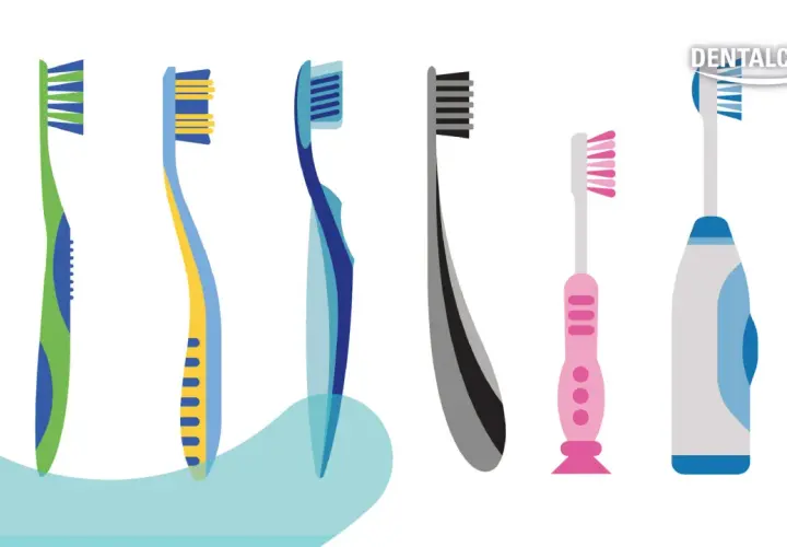 Una fila di spazzolini da denti colorati, alcuni manuali e altri elettrici, con setole spazzolino di varie forme e colori.