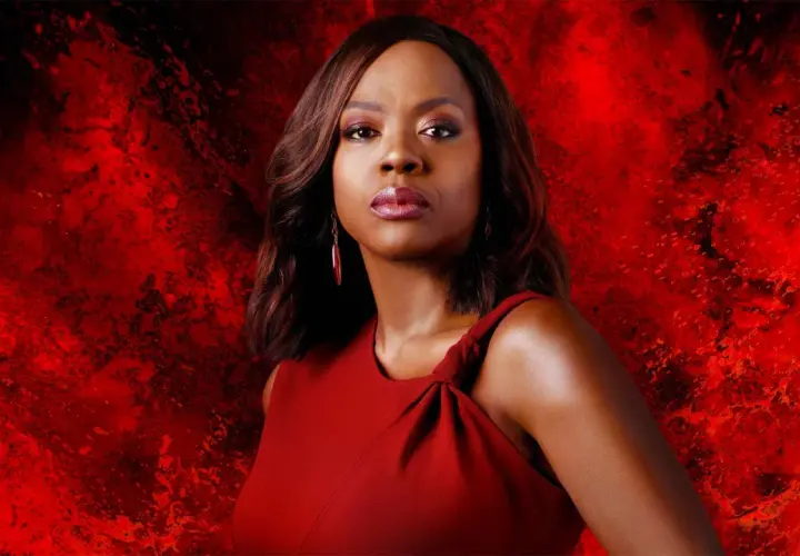 Viola Davis in a red dress against a fiery red background.