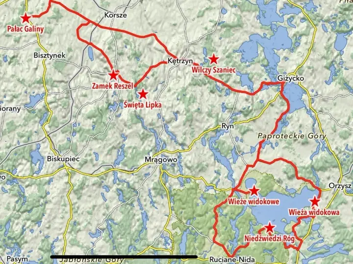 Mapa z zaznaczonymi trasami motocyklowymi na Warmii i Mazurach, z widocznymi jeziorami i nazwami miejscowości.