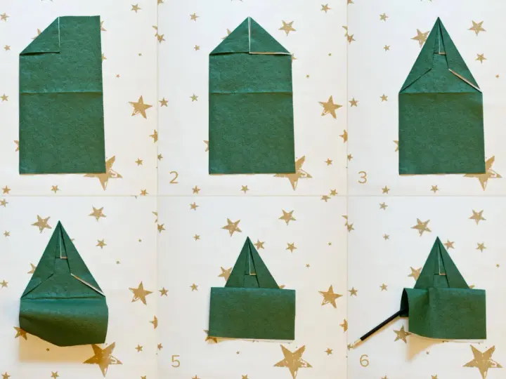 Passaggi per creare alberelli di Natale con tovaglioli piegati. Un modo creativo per decorare la tavola delle feste.