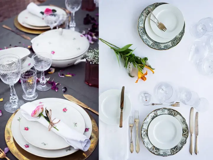 Vackert dukat bord med vita rosa tallrikar, glas och blommor. En romantisk middagsbjudning väntar.