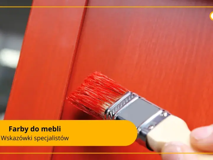 Pędzel z czerwonymi włoskami nakłada farby do malowania na drewnie na pomarańczowe meble.