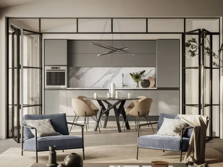 Spazio aperto con cucina moderna e zona relax, dove la cucina e camera da letto insieme creano un ambiente unico e funzionale.