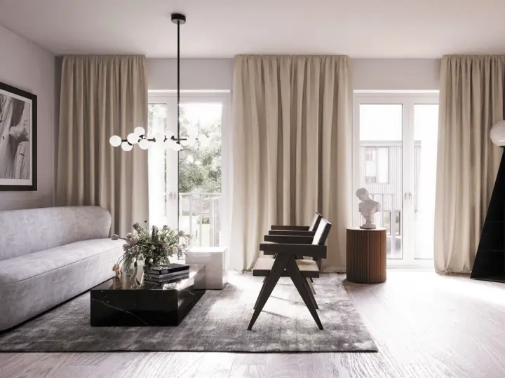 Ett elegant vardagsrum med skandinavisk inredning. En ljus soffa, marmorbord och en unik golvlampa skapar en stilfull atmosfär.