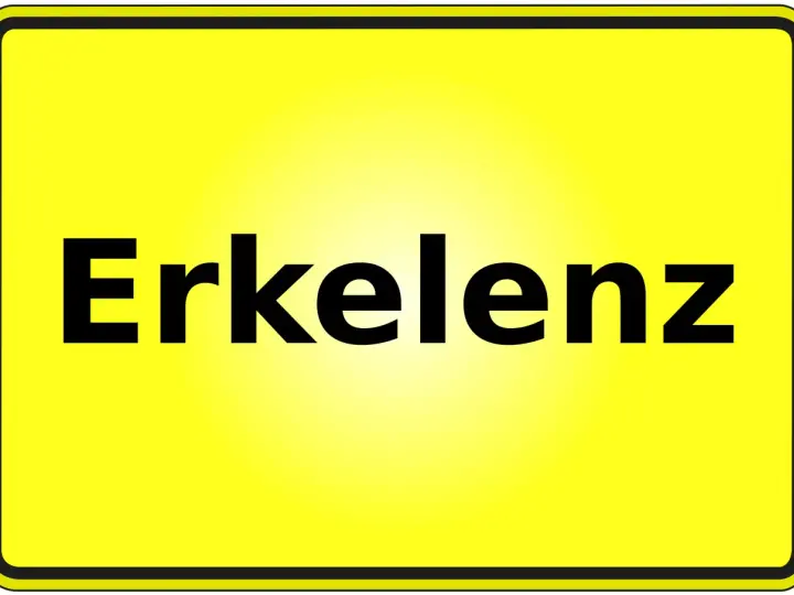 Gelbes Ortsschild mit schwarzer Schrift "Erkelenz". Hier finden Sie Informationen zum Mietspiegel Erkelenz.