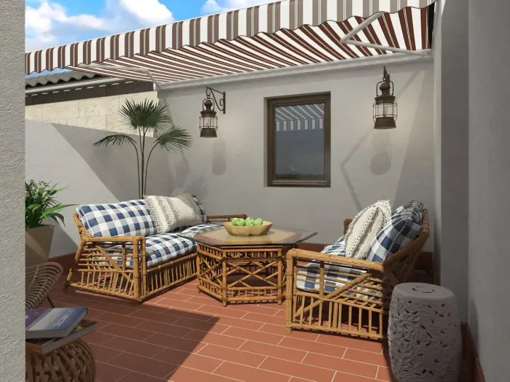 Ideas para decorar patios pequeños con poco dinero: muebles de ratán, cojines a cuadros y plantas crean un oasis acogedor.