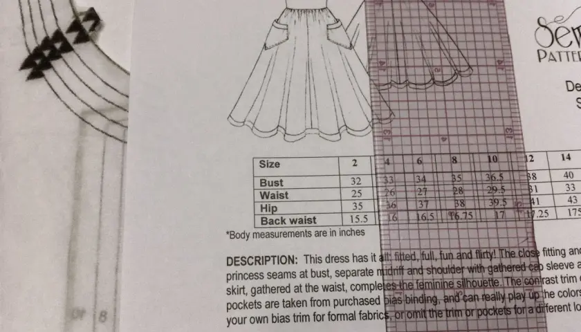 Sewing pattern for a dress with a size chart and description. Learn how to shorten a dress at the waist by consulting the measurements.
