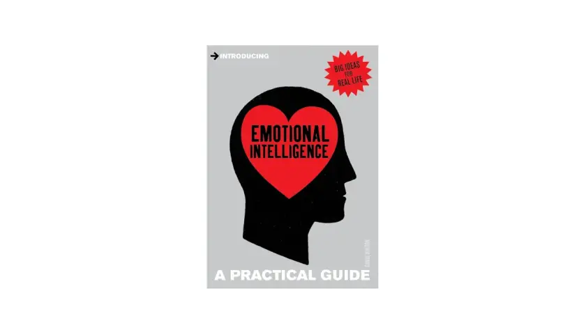 Book cover: "Emotional Intelligence: A Practical Guide." A silhouette of a head contains a red heart with the title. This guide fosters care and compassion.