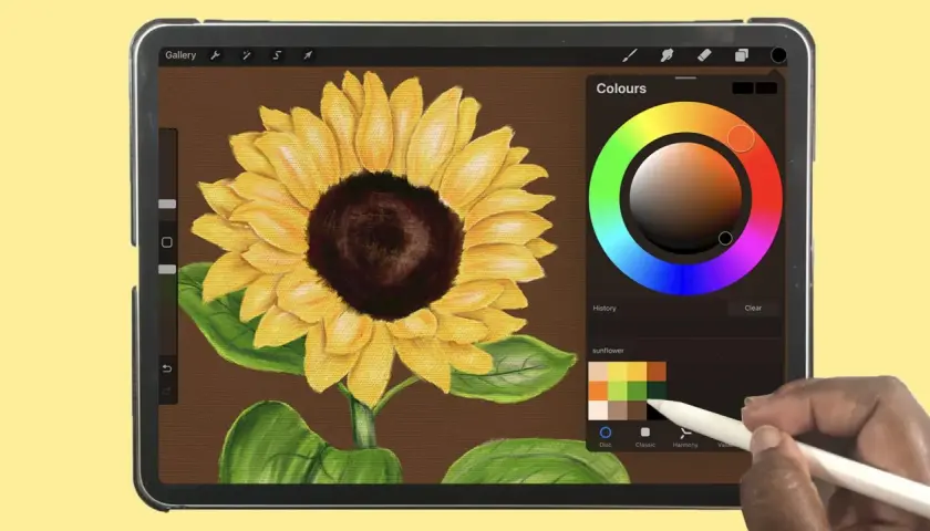 Mit einem Stift auf dem iPad malen: Ein Sonnenblumenbild entsteht mit lebendigen Farben und Texturen.