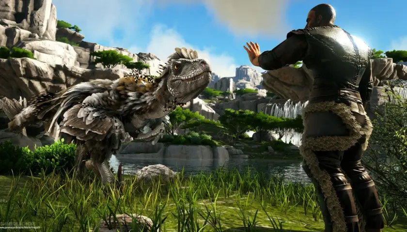 Człowiek w futrzanych strojach wita się z pierzastym dinozaurem. Premiera ark 2.
