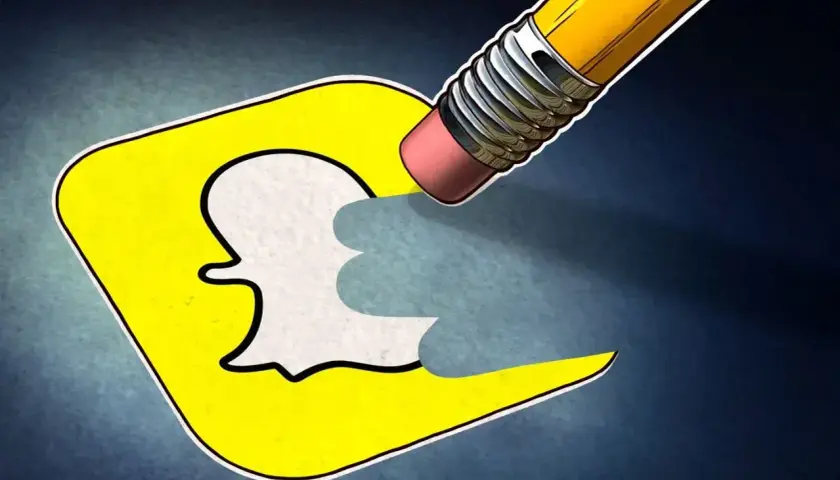 Gumka ołówka ściera logo Snapchata, symbolizując, jak usunąć konto na Snapie.
