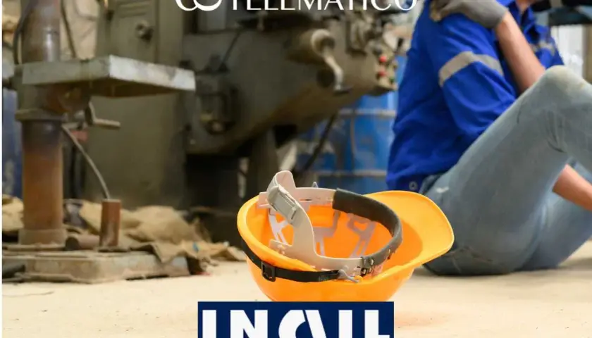Operaio a terra, soccorso da un collega, con casco arancione e logo INAIL. Un **infortunio sul lavoro oltre 30 giorni** può cambiare la vita.