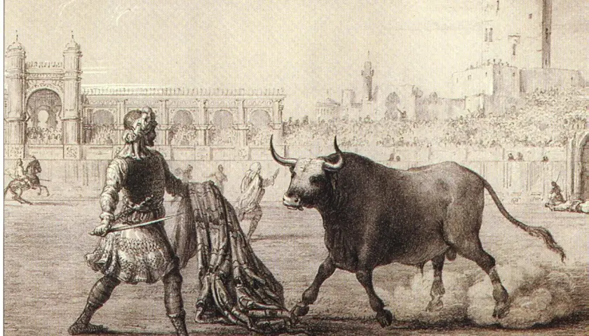 Un torero se enfrenta a un toro bravo en la arena, con público y arquitectura de la época. Es la primera corrida de toros.
