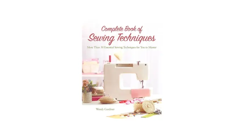 Cover of "Complete Book of Sewing Techniques" by Wendy Gardiner, featuring a sewing machine and supplies. A helpful sewing machine guide.