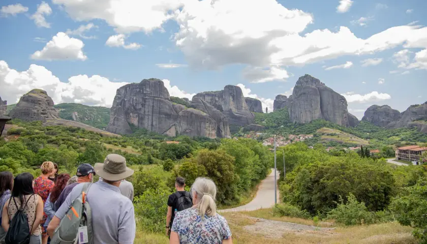 Tourists admire the stunning Meteora price, with its towering rock formations and monasteries.